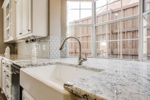 White Ice Granite with White Cabinets and Honeycomb Matte Ceramic Backsplash